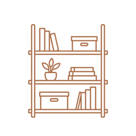 An organized home workspace with an oak desk, laptop, flowers, and bronze lamp.